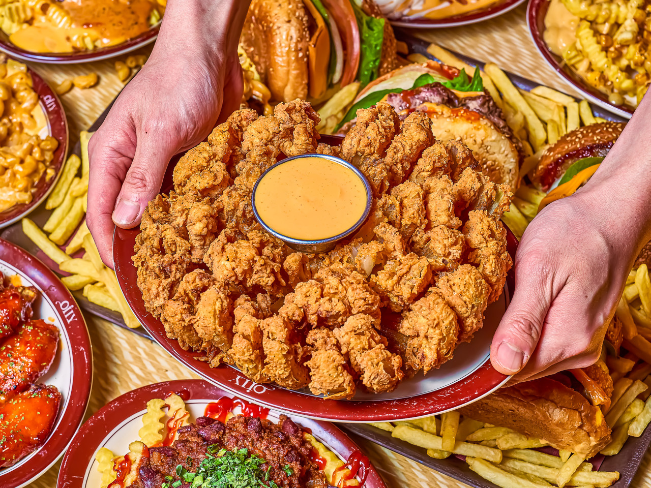 Golden blooming onion with signature dipping sauce