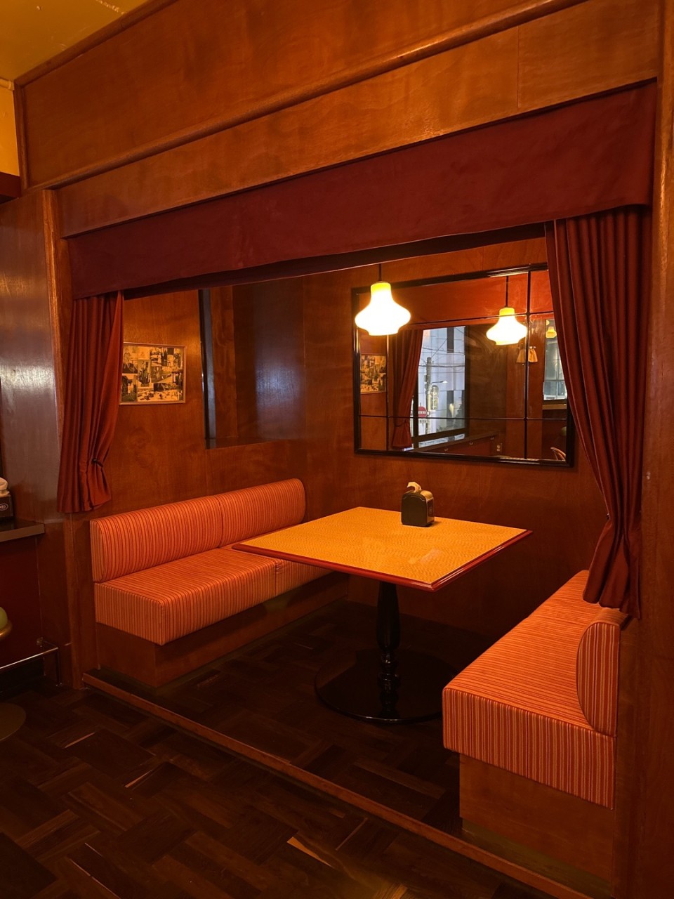 Wood-paneled retro diner booth