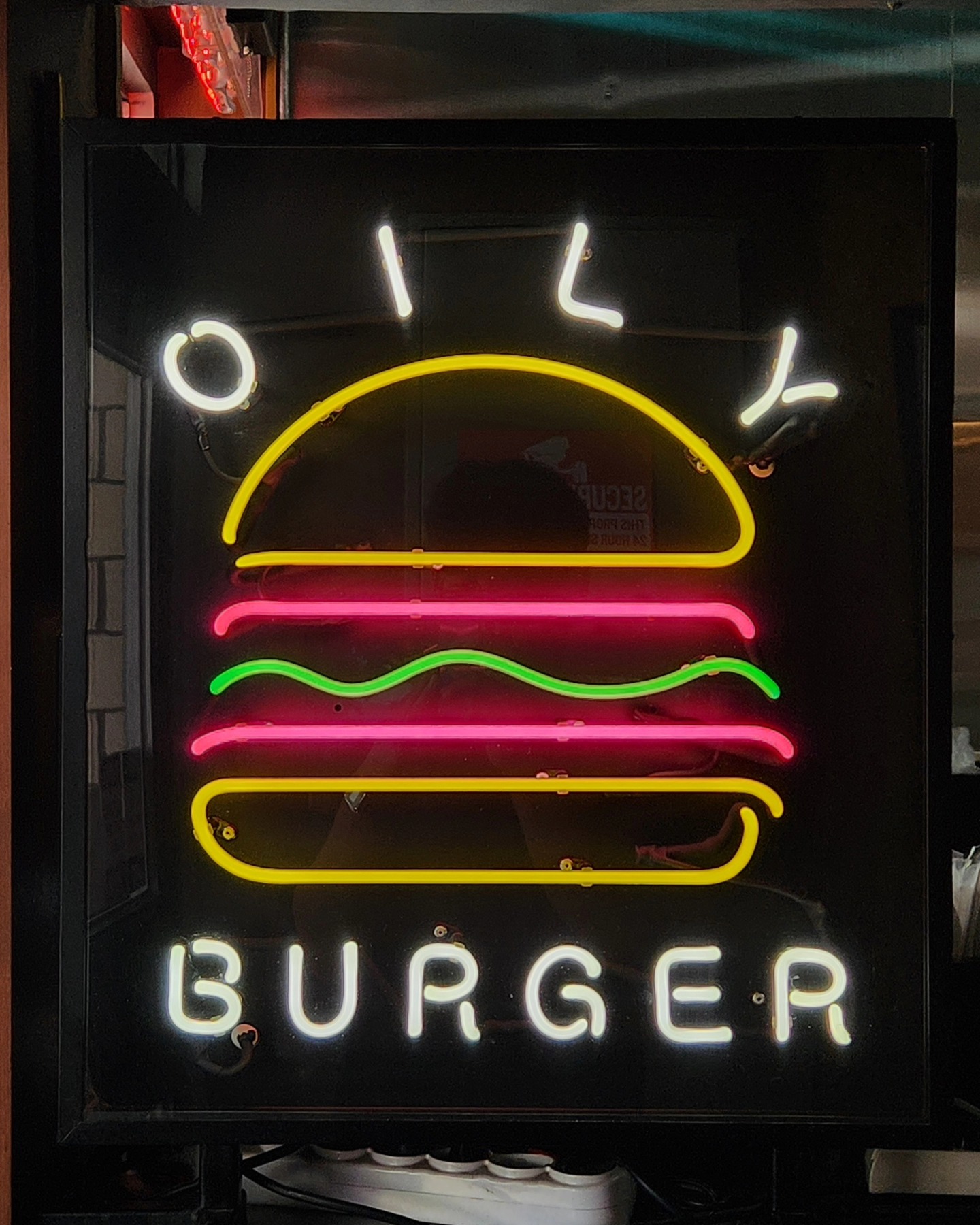Beomeo — neon burger sign at night