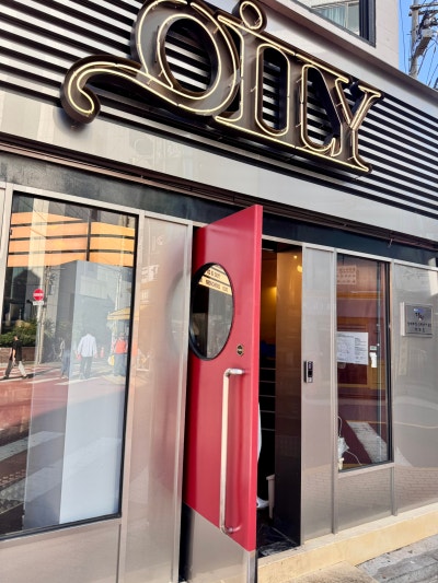 Jamsil — stainless facade with gold Oily script